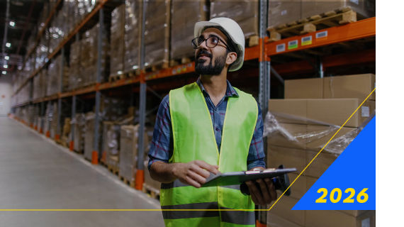 Warehouse worker with clipboard in storage area